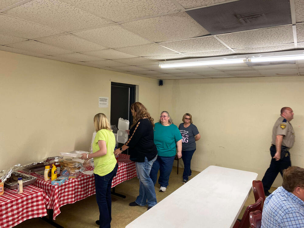 Staff standing in line for lunch.