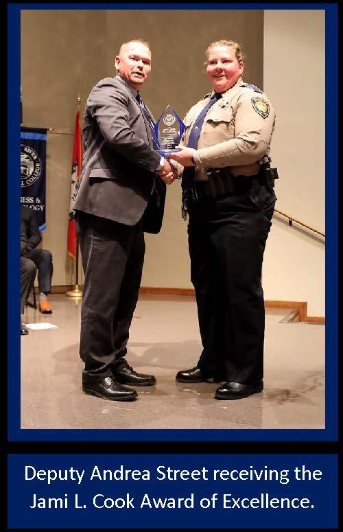 Deputy Street receiving award of excellence.