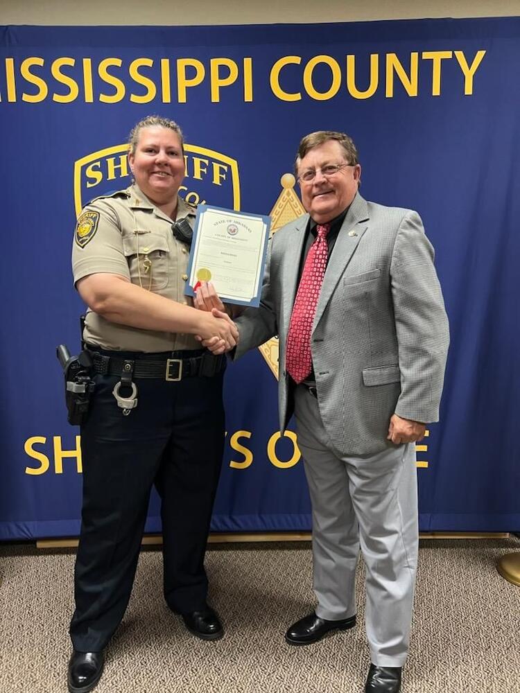 Corporal Street posing for picture with Sheriff Cook. 