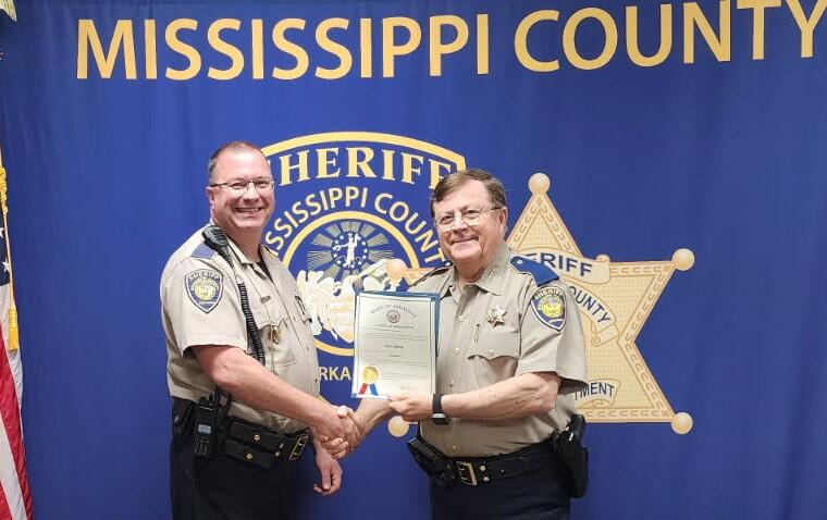Danny Bishop posing with Sheriff Cook.