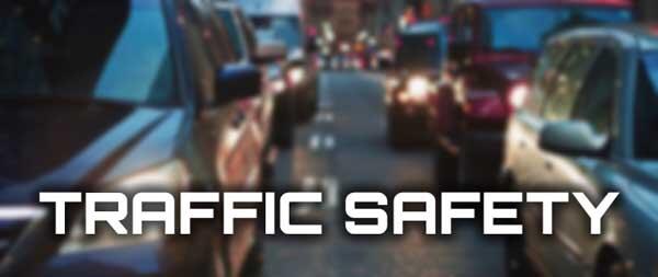 Heavy traffic on a highway with the words traffic safety.