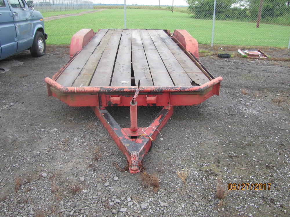 Red flat bed trailer.