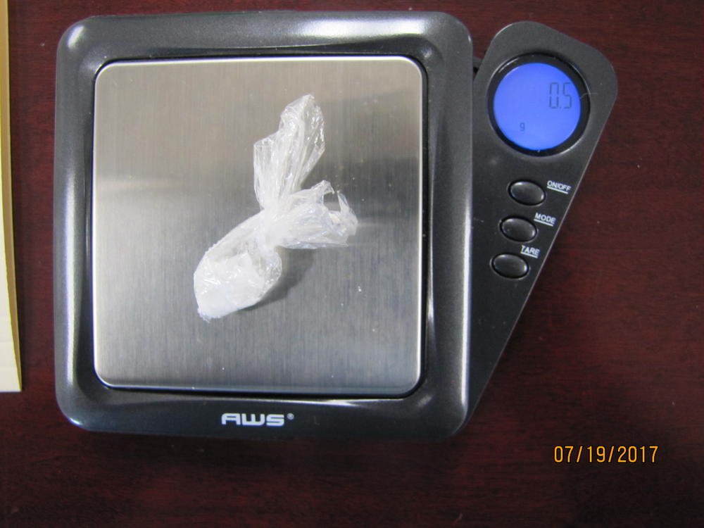 Image of drugs on scales. 