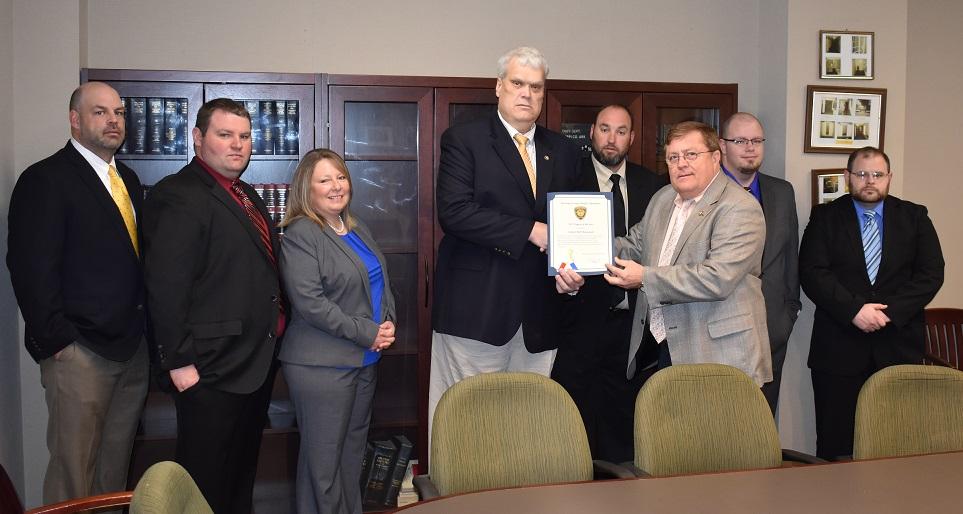 Group photo of the Criminal Investigation Division and the Sheriff.