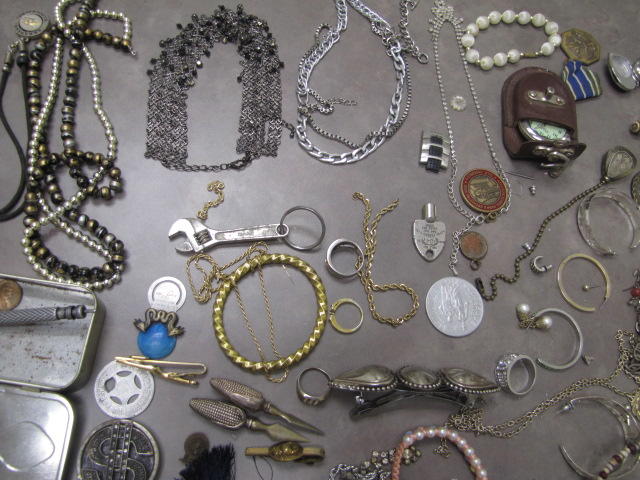 Several necklaces of a silver color.