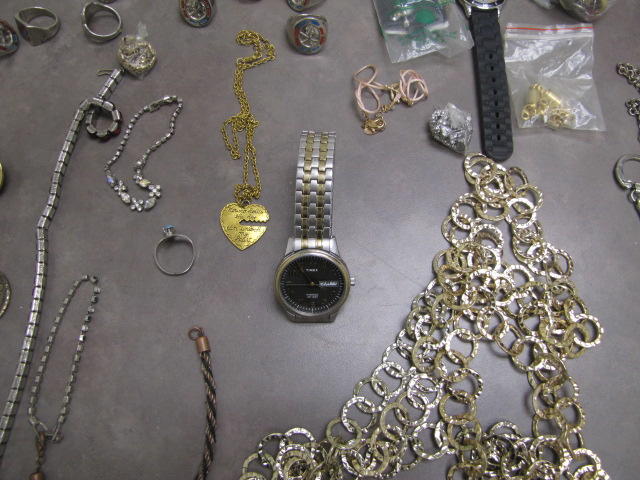 Photo of necklaces and watch.