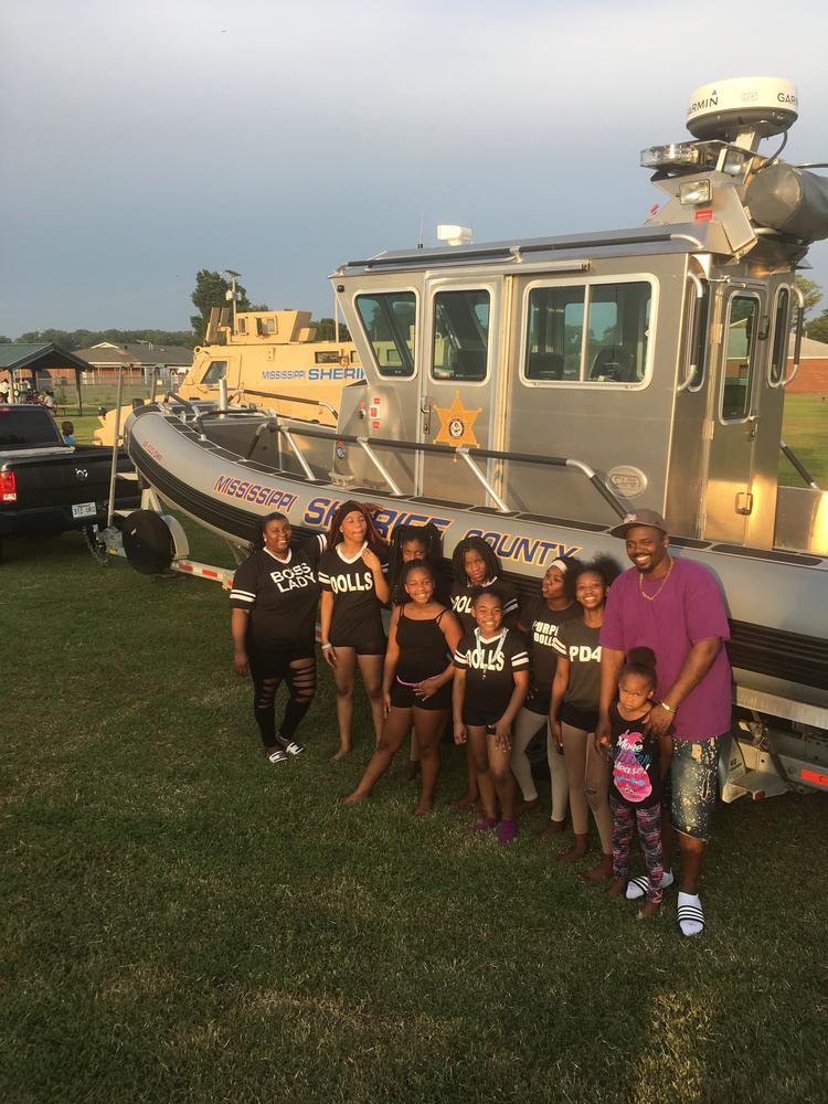 Photo of children with boat. 