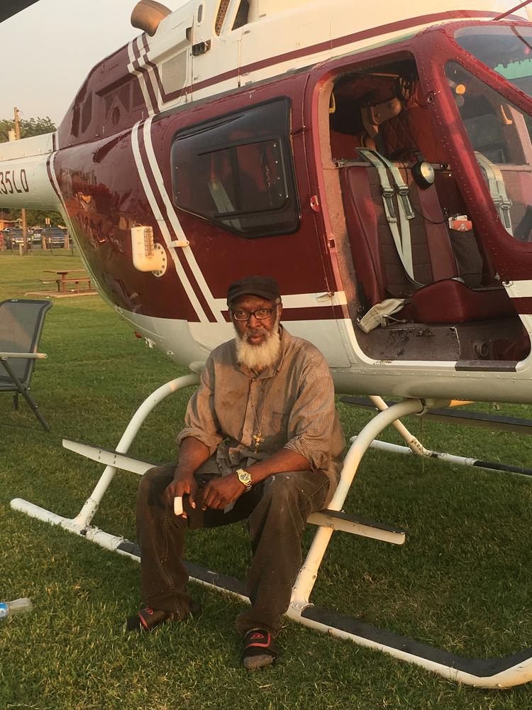 Image of older gentleman with helicopter. 