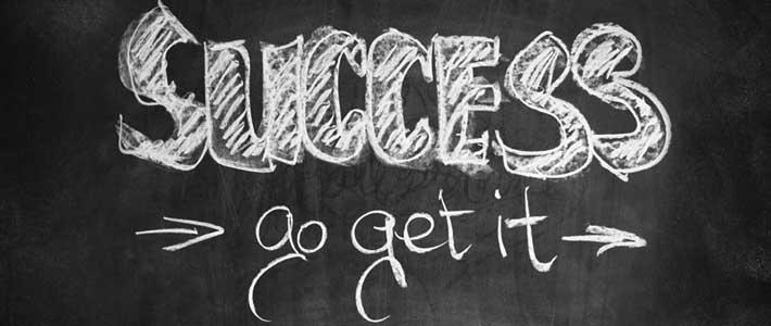 Image of a chalkboard with the words success go get it written on board.