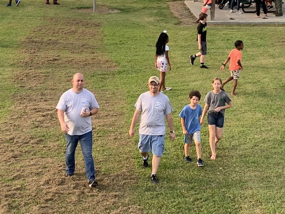 Image of attendees walking. 